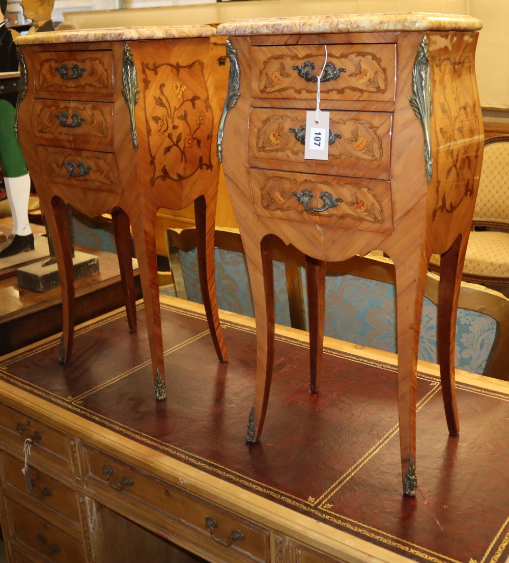 A pair of Louis XV style marquetry inlaid marble topped bedside chests, W.38cm, D.25cm, H.76cm
